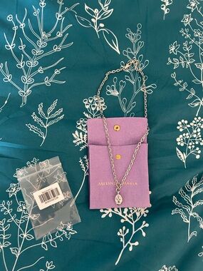 Melinda Maria Silver Oval Crystal Pendant Necklace with Purple Pouch